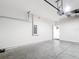 Spacious two car garage with sealed floors and an electric door at 5233 Nw 43Rd Lane Rd, Ocala, FL 34482