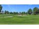 Picturesque golf course featuring manicured fairways, strategically placed sand traps, and a lush green landscape at 5233 Nw 43Rd Lane Rd, Ocala, FL 34482