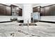Kitchen features a granite countertop, stainless steel appliances, and dark wood cabinets at 5233 Nw 43Rd Lane Rd, Ocala, FL 34482