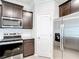 Kitchen featuring stainless steel appliances, granite countertops, and dark wood cabinets at 5233 Nw 43Rd Lane Rd, Ocala, FL 34482