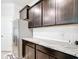 Stylish kitchen with dark cabinets, granite countertops, white subway tile backsplash, and stainless steel refrigerator at 5233 Nw 43Rd Lane Rd, Ocala, FL 34482