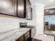 Modern kitchen showcases granite countertops, stainless steel appliances, and dark cabinets at 5233 Nw 43Rd Lane Rd, Ocala, FL 34482