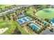 Aerial view of the community tennis courts, showcasing well-maintained facilities and recreational opportunities for residents at 5233 Nw 43Rd Lane Rd, Ocala, FL 34482