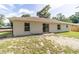 Back exterior view of home featuring sliding glass doors to a nicely sized yard at 5596 Nw 57Th St, Ocala, FL 34482