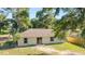 Backyard with sliding glass door, grass, and privacy fence, perfect for outdoor enjoyment at 5596 Nw 57Th St, Ocala, FL 34482