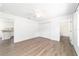 Bright bedroom features wood-look floors, closet, and ceiling fan at 5596 Nw 57Th St, Ocala, FL 34482