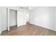 Spacious room showcasing wood-look floors and walk-in closet at 5596 Nw 57Th St, Ocala, FL 34482