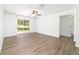 Open-concept bedroom with ceiling fan and access to outdoor area at 5596 Nw 57Th St, Ocala, FL 34482