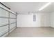 Spacious two car garage with concrete floor and door to the main home at 5596 Nw 57Th St, Ocala, FL 34482