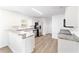 Well-lit kitchen featuring stainless steel appliances, neutral countertops, and white cabinets at 5596 Nw 57Th St, Ocala, FL 34482