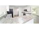 Bright kitchen features granite countertops, stainless steel appliances, and ample counter space at 5596 Nw 57Th St, Ocala, FL 34482