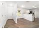 Bright living space featuring modern flooring, a breakfast bar, and sleek, modern appliances at 5596 Nw 57Th St, Ocala, FL 34482