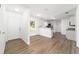 Open concept living and kitchen area with neutral walls, wood-look floors at 5596 Nw 57Th St, Ocala, FL 34482