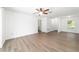 A well-lit living room featuring laminate floors and neutral paint scheme at 5596 Nw 57Th St, Ocala, FL 34482