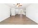 Open floor plan with wood-look flooring throughout and neutral walls at 5596 Nw 57Th St, Ocala, FL 34482