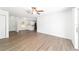 Open-concept living space with light, wood-look floors and a ceiling fan at 5596 Nw 57Th St, Ocala, FL 34482