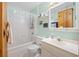 Clean bathroom with tub, shower, vanity, toilet, and mirror at 581 Ne 44Th Ave, Ocala, FL 34470