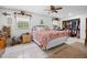 Spacious main bedroom with ceiling fan, closet, and windows for natural light at 581 Ne 44Th Ave, Ocala, FL 34470