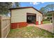 Metal garage with roll-up door offers secure parking and ample storage space at 581 Ne 44Th Ave, Ocala, FL 34470