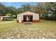 Metal garage with open bay, offering versatile space for vehicles and equipment at 581 Ne 44Th Ave, Ocala, FL 34470