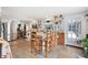 Bright kitchen featuring a center island with seating, stainless steel appliances, and ample storage at 581 Ne 44Th Ave, Ocala, FL 34470