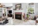 Living room showcases a fireplace, tile flooring, and a cozy layout for relaxation and entertainment at 581 Ne 44Th Ave, Ocala, FL 34470