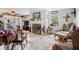 Inviting living room with tile floors, a fireplace, and comfortable furnishings creating a warm ambiance at 581 Ne 44Th Ave, Ocala, FL 34470