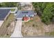 Aerial view of a home with solar panels, landscaping, and a backyard pool, showcasing the property's features at 603 Marion Oaks Blvd, Ocala, FL 34473