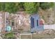 Aerial shot of a home featuring solar panels, a pool, and a well-kept backyard at 603 Marion Oaks Blvd, Ocala, FL 34473