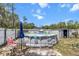 Above-ground pool in a fenced backyard, ideal for summer fun and leisure, along with accessories at 603 Marion Oaks Blvd, Ocala, FL 34473