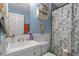 Charming bathroom with a seahorse decoration and stylish beach themed shower curtain at 603 Marion Oaks Blvd, Ocala, FL 34473