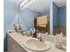 Dual vanity sinks offer lots of space and an adjacent shower at 603 Marion Oaks Blvd, Ocala, FL 34473