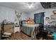 Nicely appointed bedroom featuring stylish decor, a ceiling fan, and comfortable furnishings, ready for relaxation at 603 Marion Oaks Blvd, Ocala, FL 34473
