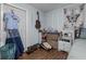 Cozy bedroom with guitar hanging, fairy lights and vintage decorations, creating a comfortable and unique space at 603 Marion Oaks Blvd, Ocala, FL 34473