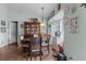 A bright dining area with a round table, wooden chairs, and a decorative china cabinet in a homey setting at 603 Marion Oaks Blvd, Ocala, FL 34473