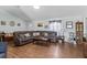 Spacious living room featuring hardwood floors, a comfortable sofa, and stylish decor at 603 Marion Oaks Blvd, Ocala, FL 34473