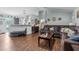 Open-concept living room boasts hardwood floors, a comfortable sofa, and flows into the kitchen at 603 Marion Oaks Blvd, Ocala, FL 34473
