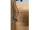 Close up of a tiled shower with a hand held shower head at 603 Marion Oaks Blvd, Ocala, FL 34473