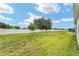 Spacious backyard with a white fence and landscaping at 6175 Sw 88Th Loop, Ocala, FL 34476