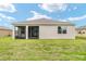 Backyard with the exterior of the home at 6175 Sw 88Th Loop, Ocala, FL 34476
