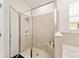 Bathroom featuring a modern glass-enclosed shower, providing a sleek and stylish bathing experience at 6175 Sw 88Th Loop, Ocala, FL 34476