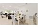 Elegant dining area featuring stylish mirrored table set, perfect for intimate gatherings and easy entertaining at 6175 Sw 88Th Loop, Ocala, FL 34476