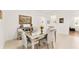 Dining area featuring a mirrored table, plush chairs, and modern decor at 6175 Sw 88Th Loop, Ocala, FL 34476