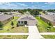 Inviting single-story home featuring a well-manicured lawn and neutral color palette, ideal for comfortable living at 6175 Sw 88Th Loop, Ocala, FL 34476