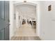 Inviting home foyer with arched entryway leading to living and dining spaces with neutral tile flooring at 6175 Sw 88Th Loop, Ocala, FL 34476