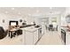 Modern kitchen design showcases granite countertops, stainless appliances, and an open layout ideal for entertaining guests at 6175 Sw 88Th Loop, Ocala, FL 34476