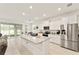 Spacious kitchen features granite countertops, stainless steel appliances, and flows seamlessly into the living space at 6175 Sw 88Th Loop, Ocala, FL 34476