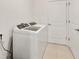 Laundry room featuring a washer and dryer and tiled floors at 6175 Sw 88Th Loop, Ocala, FL 34476