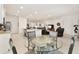 Bright living room next to kitchen features recessed lighting and an open floor plan at 6175 Sw 88Th Loop, Ocala, FL 34476
