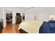 The main bedroom boasts wood floors, and easy access to the walk-in closet and Primary bathroom at 6175 Sw 88Th Loop, Ocala, FL 34476